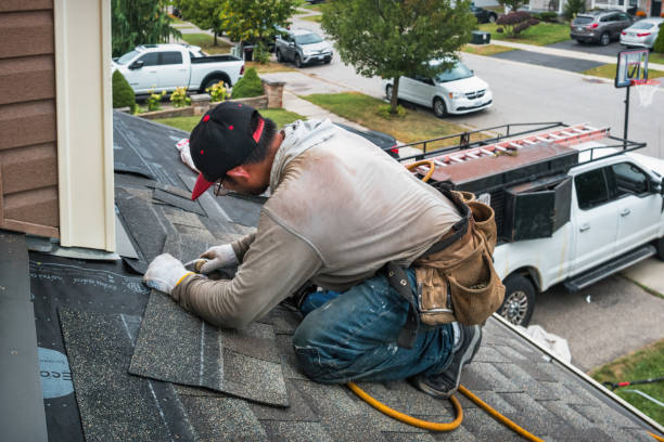 Professional Roofing technician working in Postville, IA